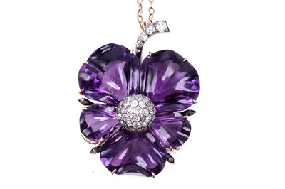 Lot 524 - A late Victorian carved amethyst and diamond pansy pendant