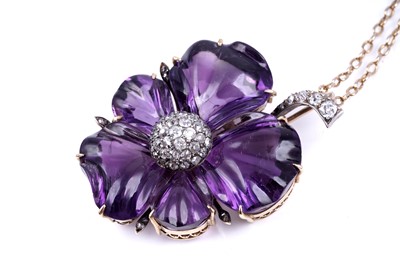 Lot 524 - A late Victorian carved amethyst and diamond pansy pendant
