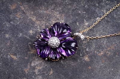 Lot 524 - A late Victorian carved amethyst and diamond pansy pendant