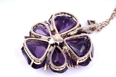 Lot 524 - A late Victorian carved amethyst and diamond pansy pendant