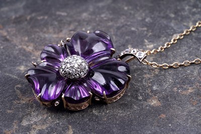 Lot 524 - A late Victorian carved amethyst and diamond pansy pendant