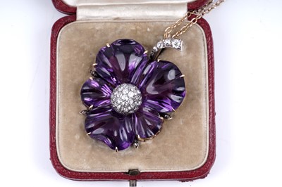Lot 524 - A late Victorian carved amethyst and diamond pansy pendant