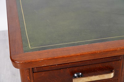 Lot 90 - A mid-Century oak pedestal desk
