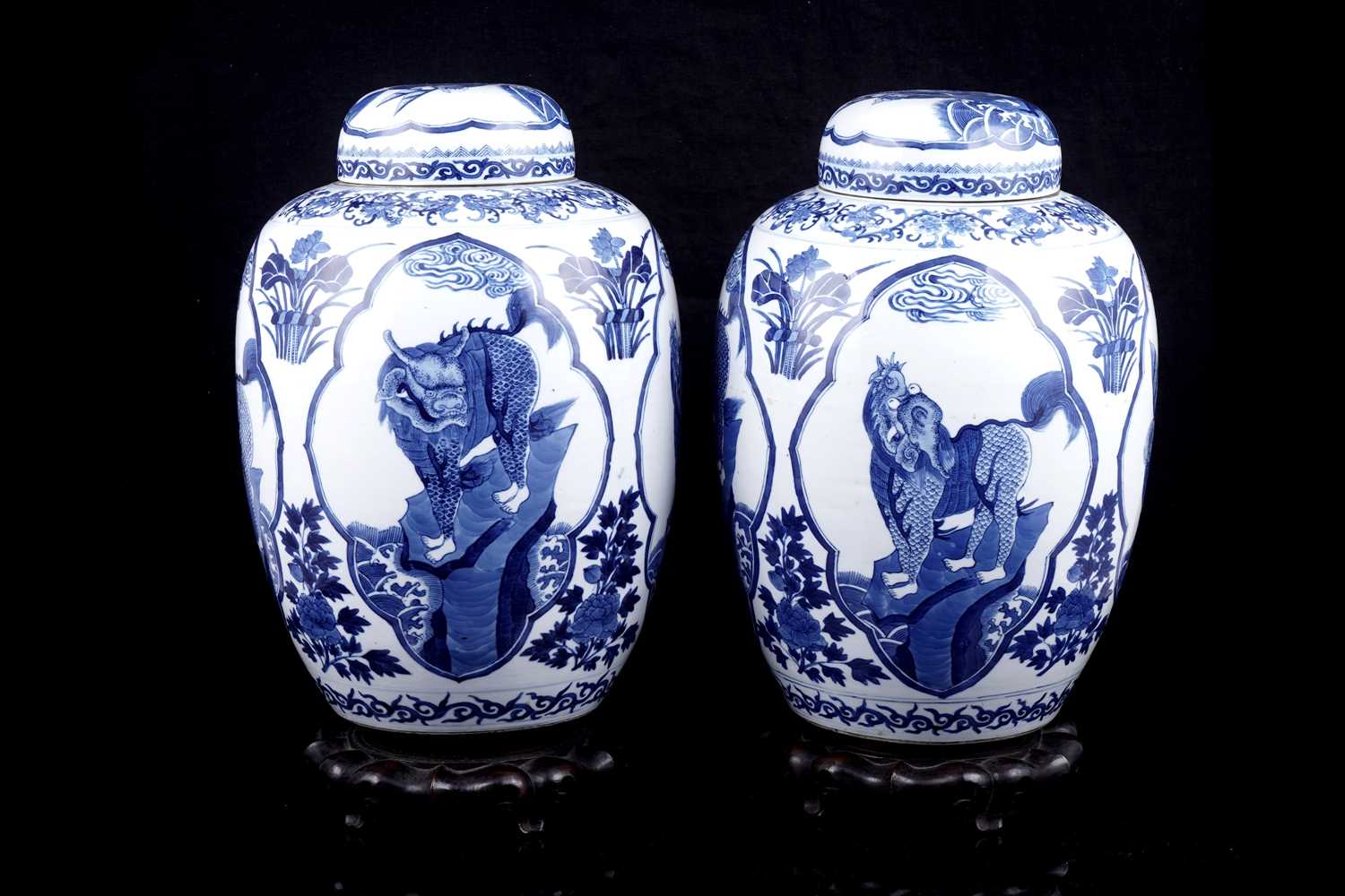Lot Pair of Chinese mythical beast jars and covers