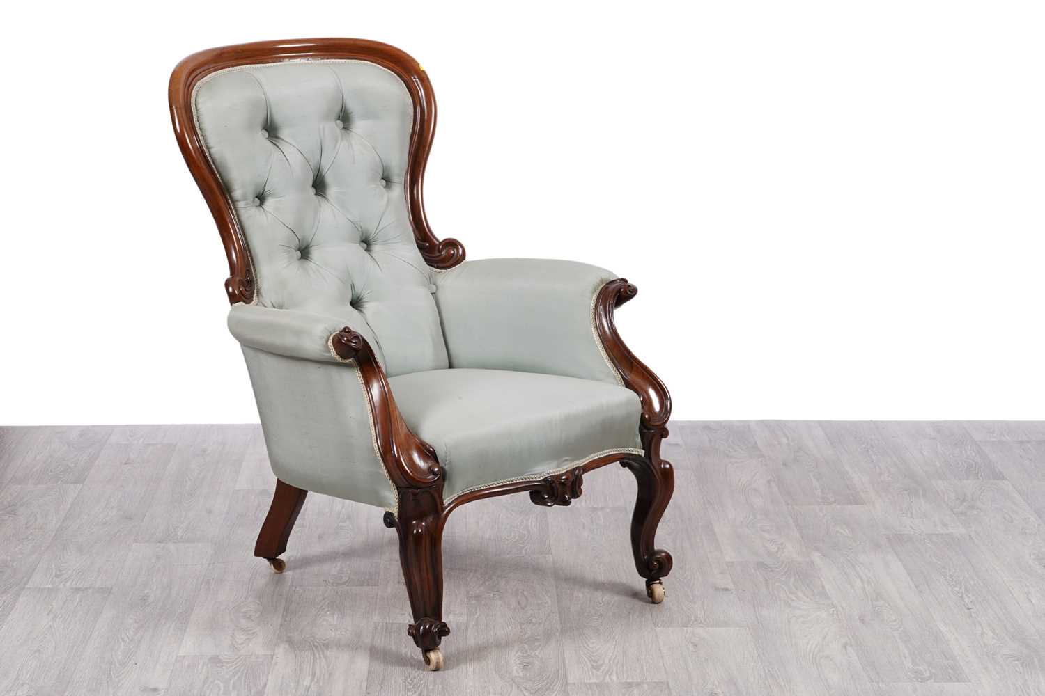 Lot 28 - A Victorian walnut framed armchair
