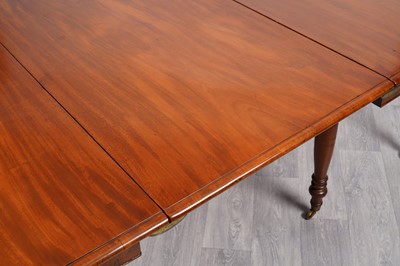 Lot 21 - A late Georgian mahogany dining table