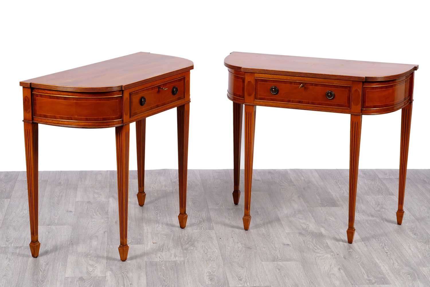 Lot 30 - A pair of reproduction Regency breakfront side tables