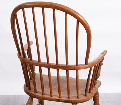 Lot 50 - A 19th Century Windsor armchair; and another of elm wood construction