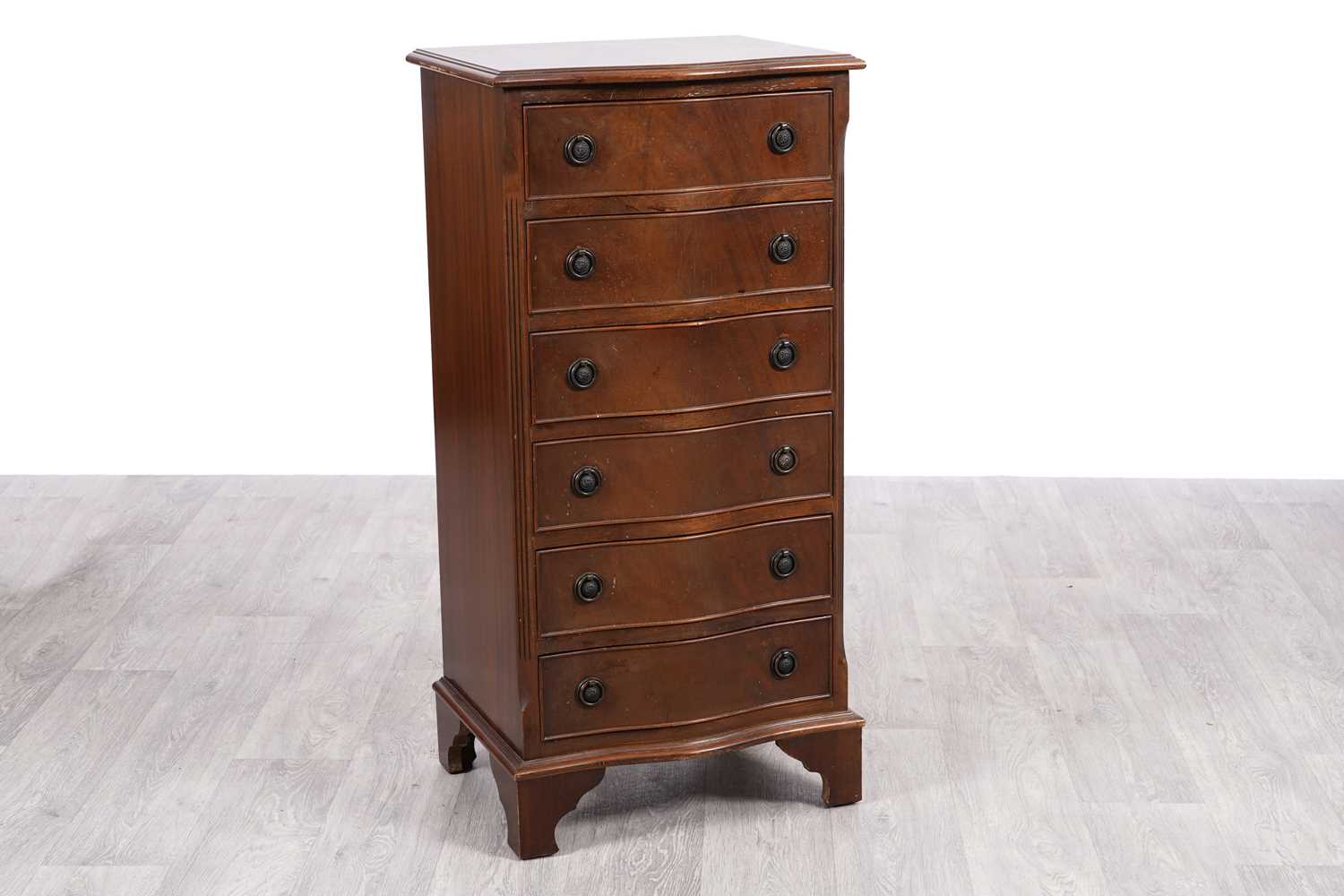 Lot 31 - A reproduction serpentine fronted tall chest of six drawers