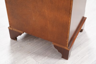 Lot 31 - A reproduction serpentine fronted tall chest of six drawers