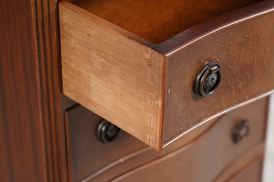 Lot 31 - A reproduction serpentine fronted tall chest of six drawers