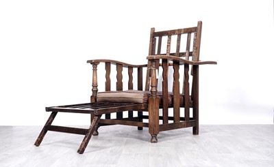 Lot 47 - An early 20th Century oak metamorphic reclining chair