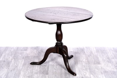 Lot 15 - A Georgian oak tilt-action occasional table
