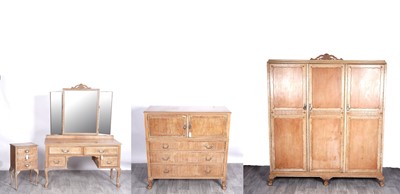 Lot 69 - A 19th Century-style French blond walnut bedroom suite of furniture