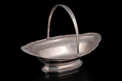 Lot 102 - A George III Scottish silver bread basket of shaped oval outline