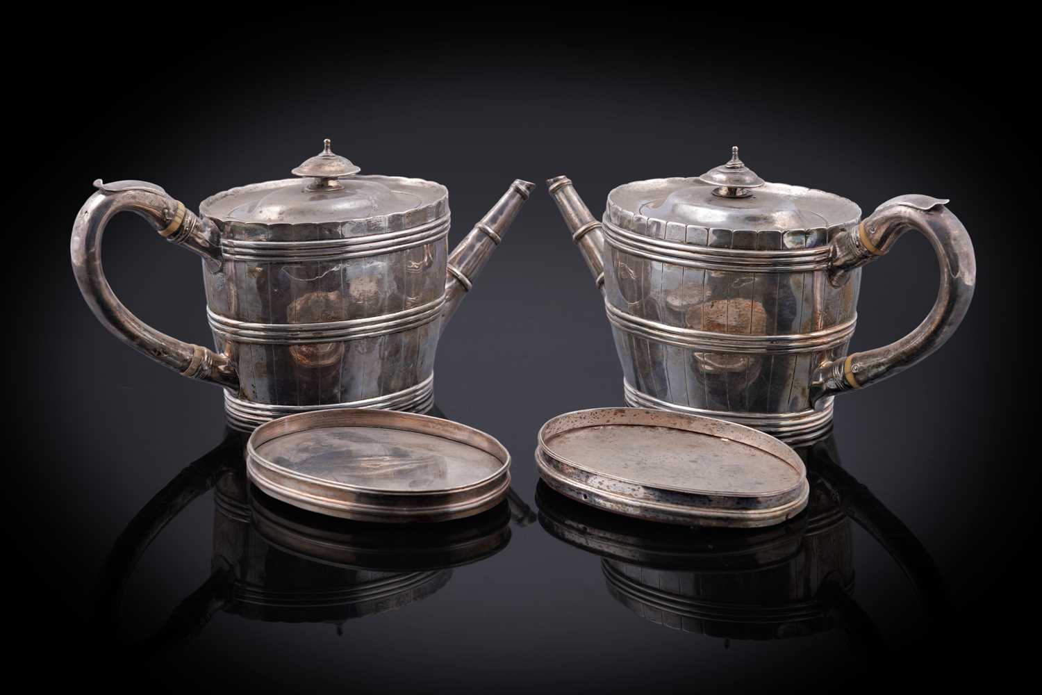 Lot 107 - A George III silver teapot; and an early Victorian silver teapot
