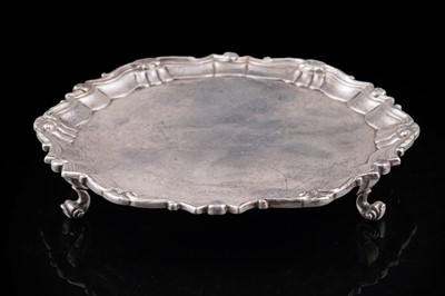 Lot 109 - A George II silver waiter of shaped circular outline