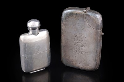 Lot 110 - A late Victorian novelty silver spirit flask; and a smaller, conventional silver spirit flask