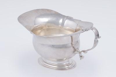 Lot 2 - A George V silver sauceboat on a stepped oval foot