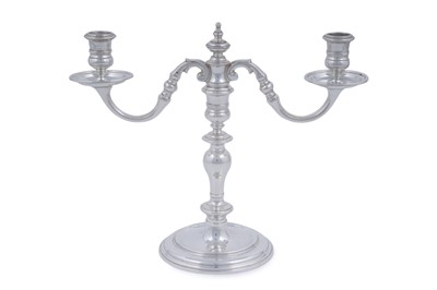 Lot 9 - A matched pair of Elizabeth II cast silver twin-light candelabra