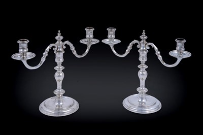 Lot 9 - A matched pair of Elizabeth II cast silver twin-light candelabra