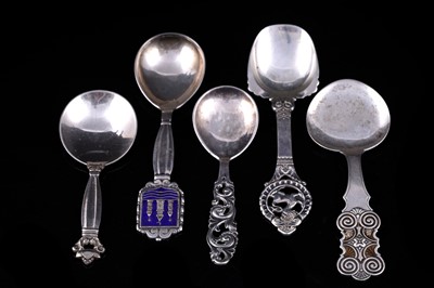 Lot 148 - A Georg Jensen silver Acorn pattern caddy spoon; and four various Scandinavian