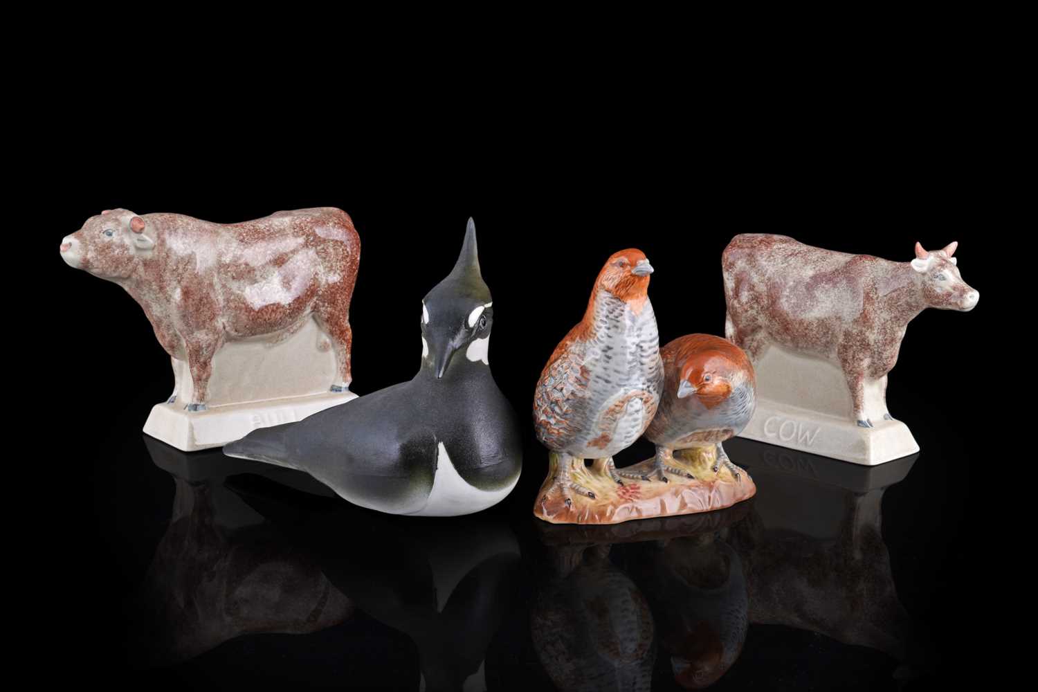 Lot 255 - A selection of ceramic figures