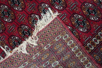 Lot 166 - Two mid-20th Century Pakistani Bokara-style rugs