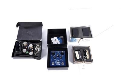 Lot 264 - A power amp simulator; and three set of guitar pickups