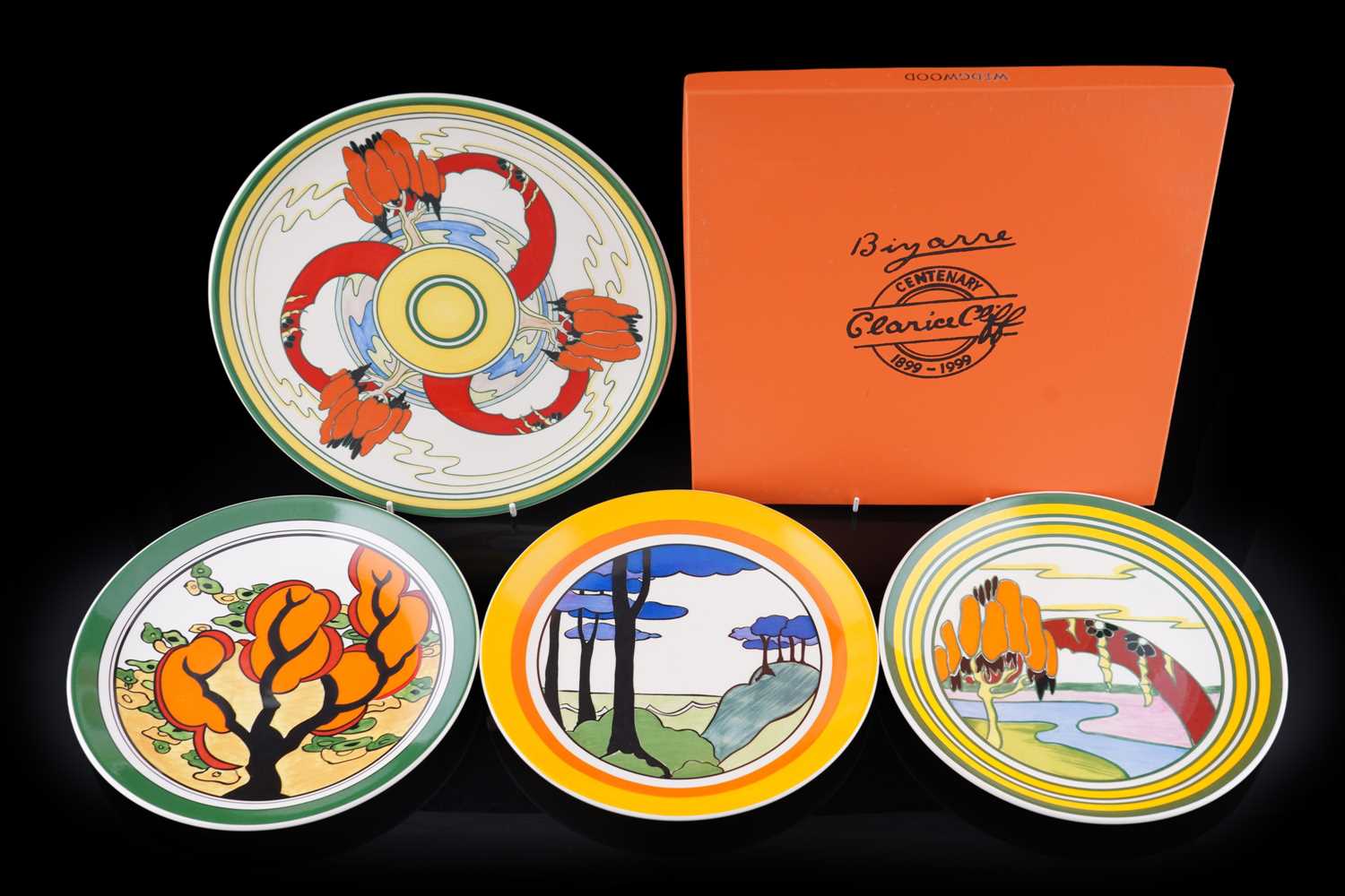 Lot 243 - A boxed Wedgwood ‘Clarice Cliff Bizarre Centenary’ charger; and three plates