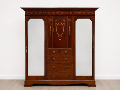 Lot 67 - An Edwardian mahogany inlaid triple wardrobe