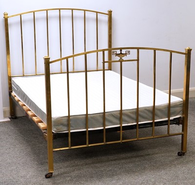 Lot 80 - An Arts & Crafts-style brass double bed frame