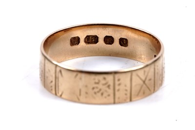 Lot 65 - An 18ct gold wedding band