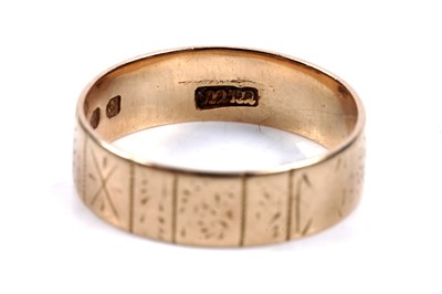 Lot 65 - An 18ct gold wedding band