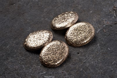 Lot 68 - A pair of Edwardian gold cuff links with engraved floral decoration