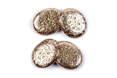 Lot 68 - A pair of Edwardian gold cuff links with engraved floral decoration