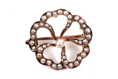 Lot 70 - An Edwardian seed pearl openwork brooch