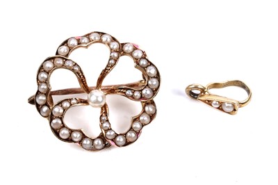 Lot 70 - An Edwardian seed pearl openwork brooch