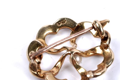 Lot 70 - An Edwardian seed pearl openwork brooch
