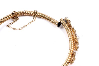 Lot 71 - An early 20th Century seed-pearl hinged bangle