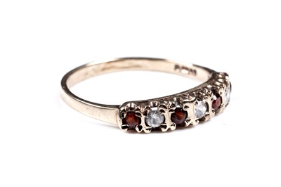 Lot 36 - A white spinel and tourmaline ring, on 9ct; and a Mexican synthetic colour-change sapphire ring