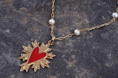 Lot 541 - A 14ct yellow gold and enamel pendant on pearl set chain