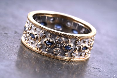 Lot 543 - A bespoke-made sapphire and diamond eternity ring