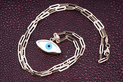 Lot 544 - A modern 'All Seeing Eye' pattern pendant on chain