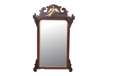 Lot 99 - A Georgian mahogany fret carved wall mirror