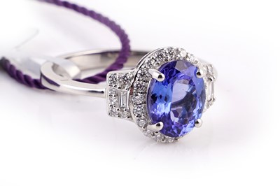 Lot 409 - A contemporary tanzanite and diamond ring