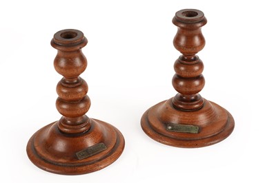 Lot 351 - A pair of turned teak candlesticks made with wood taken from RMS Mauretania