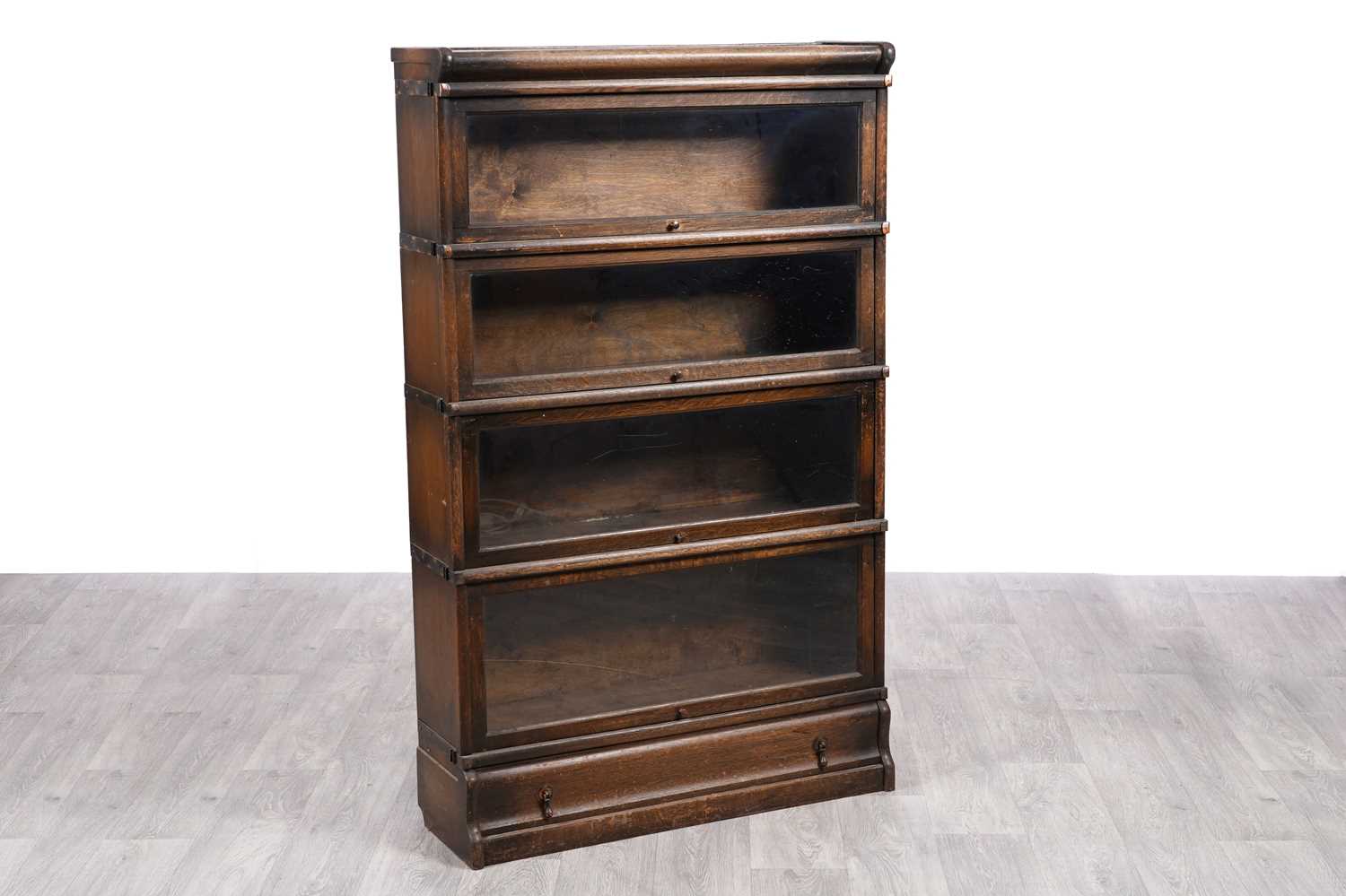 Lot 2 - An oak sectional bookcase