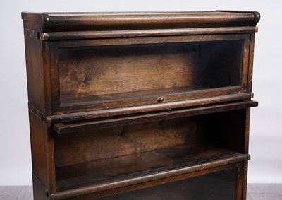Lot 2 - An oak sectional bookcase