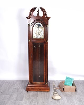 Lot 86 - A Howard and Miller mahogany cased longcase clock